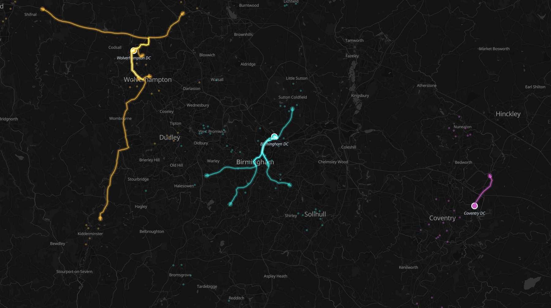 Fleet snapshot with glowing road-following vehicle trails from three depots and arrow markers at each vehicle position